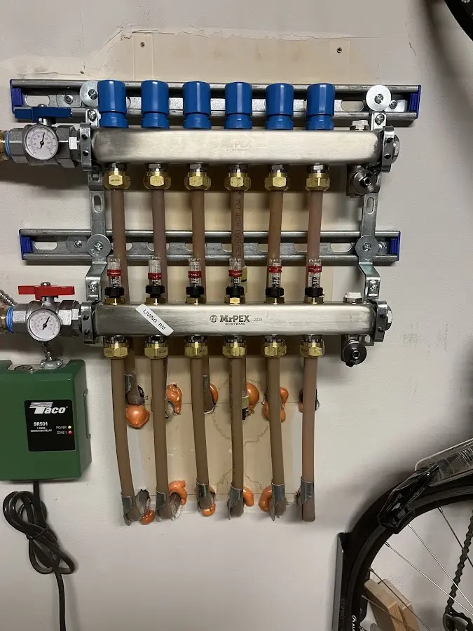 Plumber performing Gas Line Installation at a residential property in Asbury